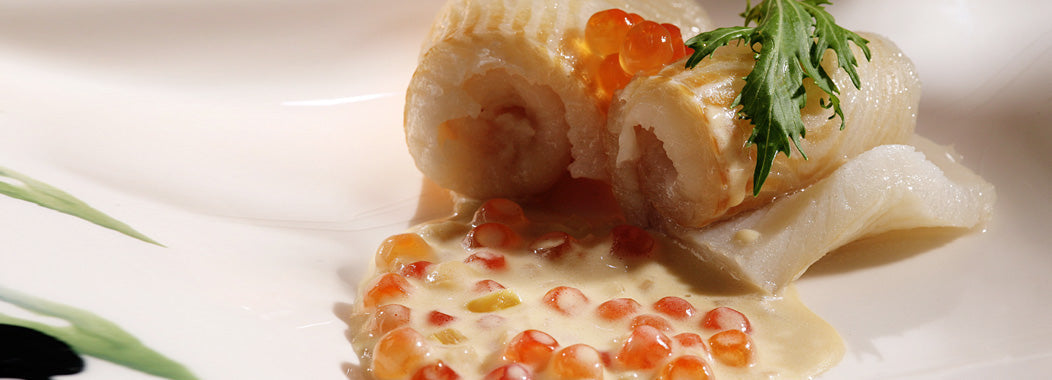 Fish rolls with caviar sauce