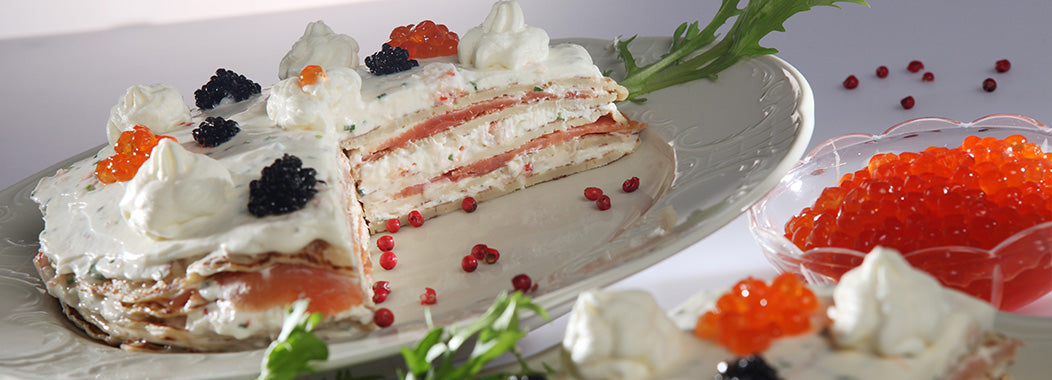 Snack pancake cake with salmon fish and caviar