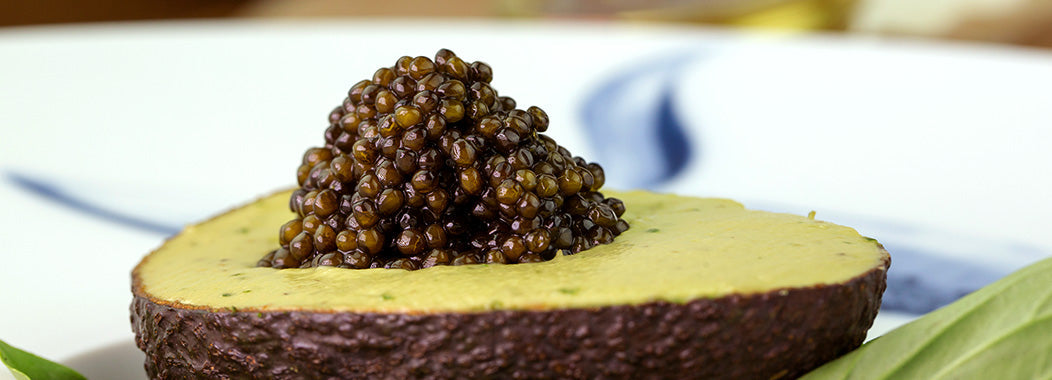 Avocado with salmon and sturgeon caviar