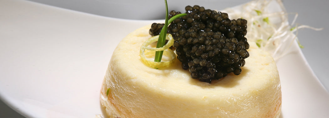 Jacobsmuschel-Soufflé mit schwarzem Kaviar